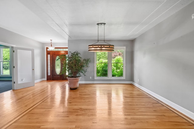 4095 Indian Hills Rd, Columbia, TN 38401 - unfurnished dining area featuring light wood-type flooring and baseboards
