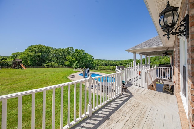 4095 Indian Hills Rd, Columbia, TN 38401 - wooden deck featuring an outdoor pool, a ceiling fan, and a playground