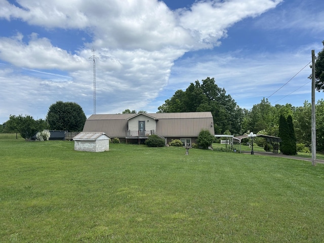 236 Beartown Rd, Loretto, TN 38469 - view of green lawn featuring an outdoor structure, a detached carport, and a shed
