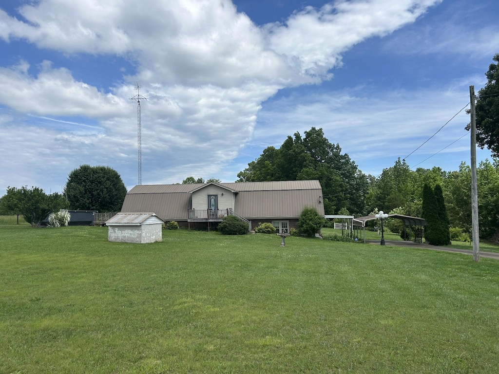 236 Beartown Rd, Loretto, TN 38469 - view of grassy yard with an outbuilding and a storage unit