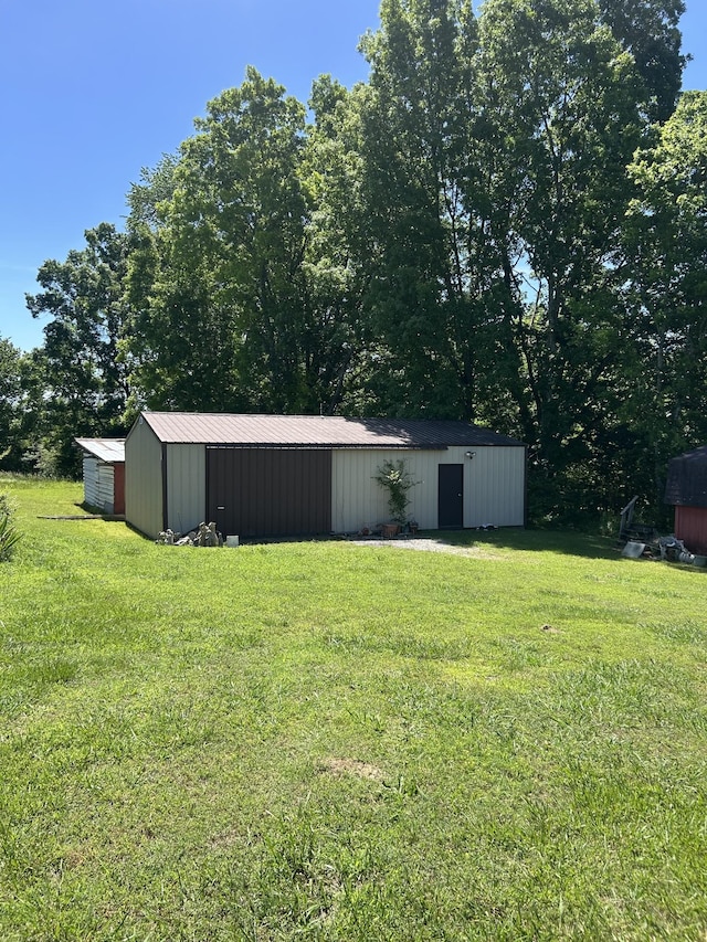 236 Beartown Rd, Loretto, TN 38469 - view of grassy yard with a pole building and an outdoor structure
