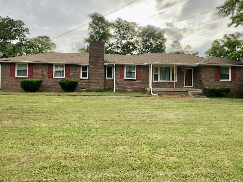 215 Highland Dr, Old Hickory, TN 37138 - ranch-style house featuring a chimney, brick siding, a front lawn, crawl space, and a shingled roof