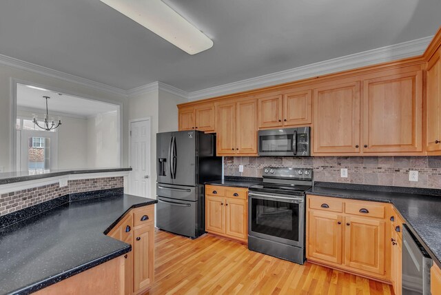 2015 Keene Cir, Spring Hill, TN 37174 - kitchen featuring stainless steel appliances, ornamental molding, a chandelier, light wood-style floors, and backsplash
