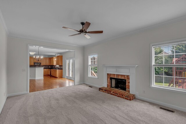 2015 Keene Cir, Spring Hill, TN 37174 - unfurnished living room with light carpet, crown molding, baseboards, and healthy amount of natural light