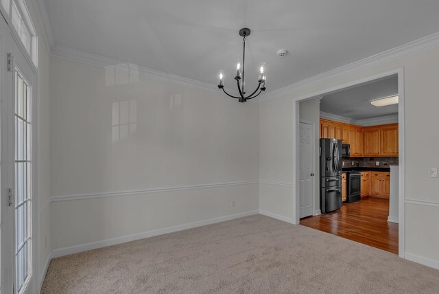 2015 Keene Cir, Spring Hill, TN 37174 - unfurnished dining area with dark carpet, a chandelier, crown molding, and baseboards