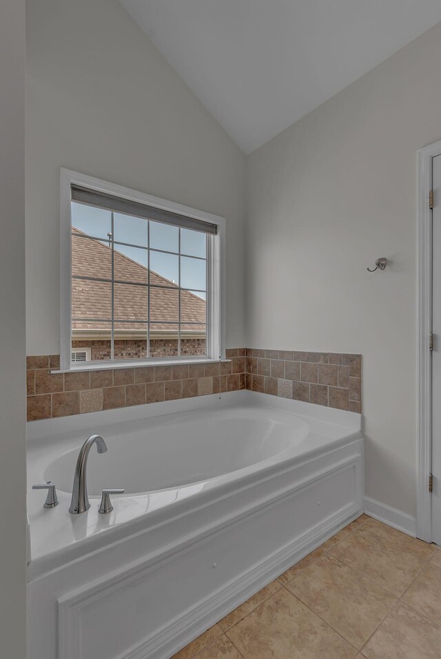 2015 Keene Cir, Spring Hill, TN 37174 - full bath with lofted ceiling, a garden tub, and tile patterned floors