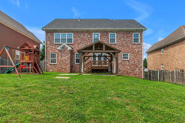 2015 Keene Cir, Spring Hill, TN 37174 - rear view of house featuring a playground, brick siding, and a deck