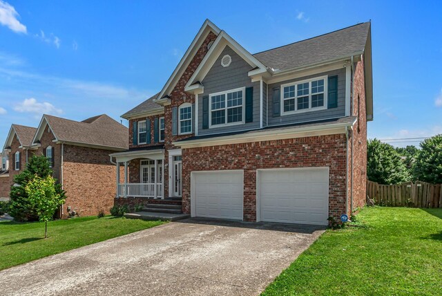 2015 Keene Cir, Spring Hill, TN 37174 - view of front of property with a garage, driveway, covered porch, and brick siding