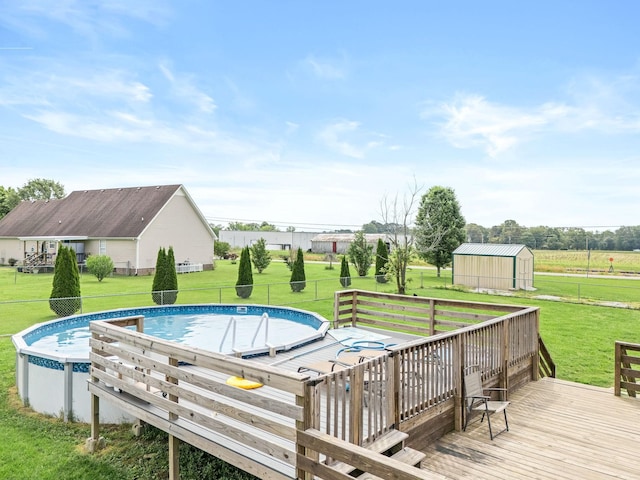 278 Riddle Rd, Manchester, TN 37355 - outdoor pool featuring a wooden deck, a storage shed, and an outdoor structure