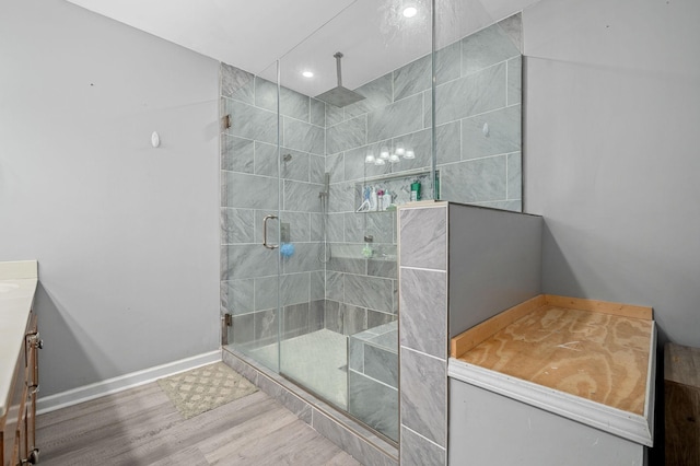 278 Riddle Rd, Manchester, TN 37355 - bathroom featuring wood finished floors, a shower stall, vanity, baseboards, and recessed lighting