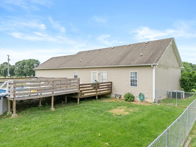 278 Riddle Rd, Manchester, TN 37355 - back of property with a wooden deck, roof with shingles, and central air condition unit