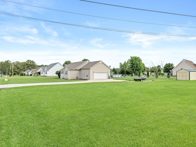 278 Riddle Rd, Manchester, TN 37355 - view of green lawn featuring concrete driveway and a garage