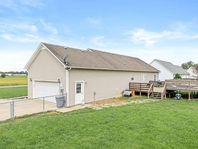 278 Riddle Rd, Manchester, TN 37355 - back of house featuring a deck, driveway, an attached garage, and a shingled roof