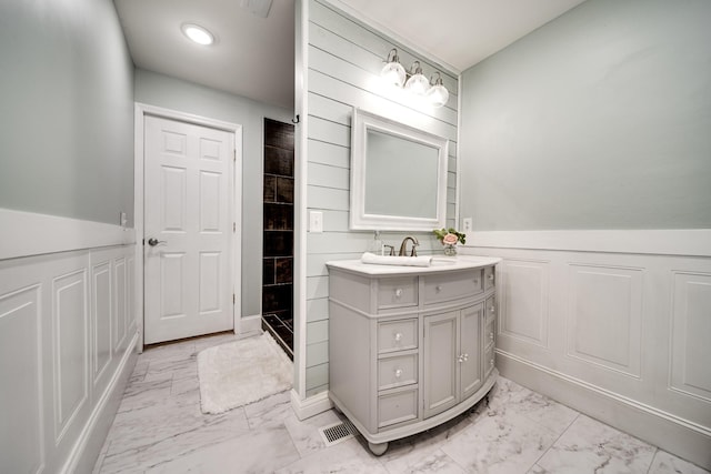1112 Belmont Dr, Cookeville, TN 38506 - bathroom with marble finish floors, a wainscoted wall, vanity, and recessed lighting