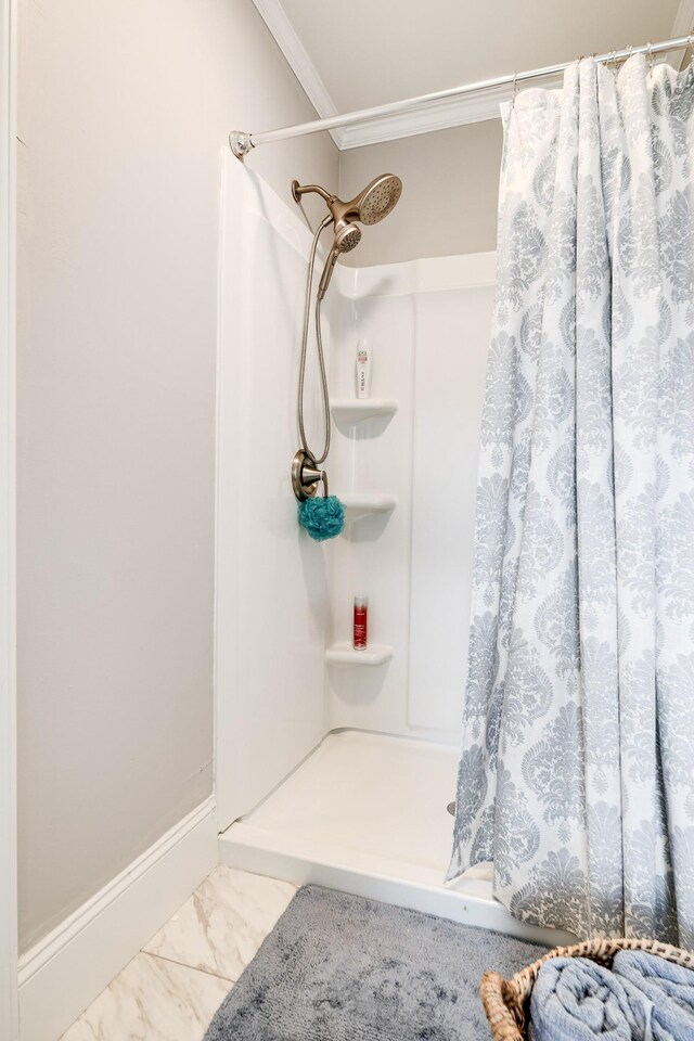 1112 Belmont Dr, Cookeville, TN 38506 - bathroom featuring ornamental molding, curtained shower, and marble finish flooring