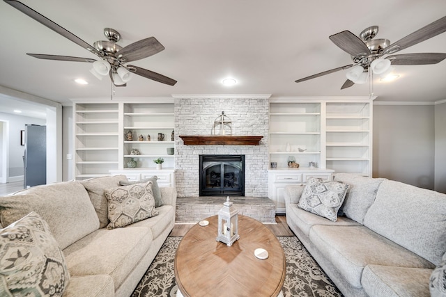 1112 Belmont Dr, Cookeville, TN 38506 - living room with ceiling fan, wood finished floors, crown molding, a fireplace, and recessed lighting