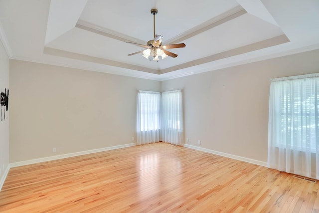 358 Spring Valley Dr, Cottontown, TN 37048 - spare room featuring a raised ceiling, a ceiling fan, light wood finished floors, and ornamental molding