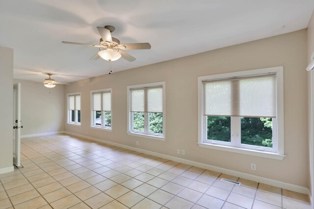 358 Spring Valley Dr, Cottontown, TN 37048 - spare room with a ceiling fan, light tile patterned floors, and baseboards