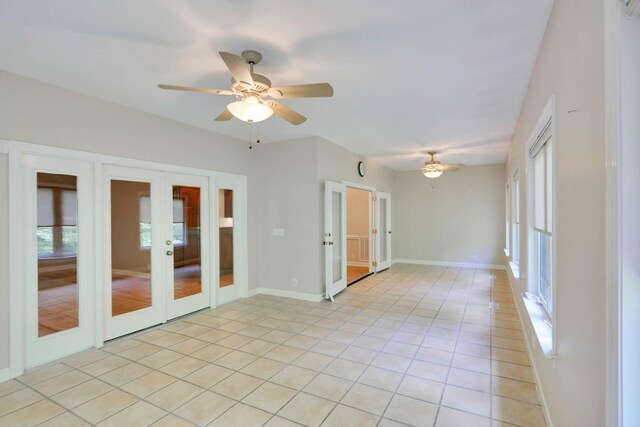 358 Spring Valley Dr, Cottontown, TN 37048 - empty room with french doors, a ceiling fan, light tile patterned flooring, and baseboards