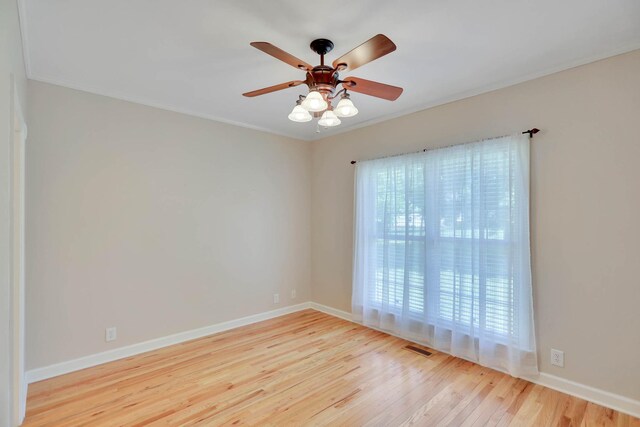 358 Spring Valley Dr, Cottontown, TN 37048 - empty room with wood finished floors, ceiling fan, baseboards, and crown molding