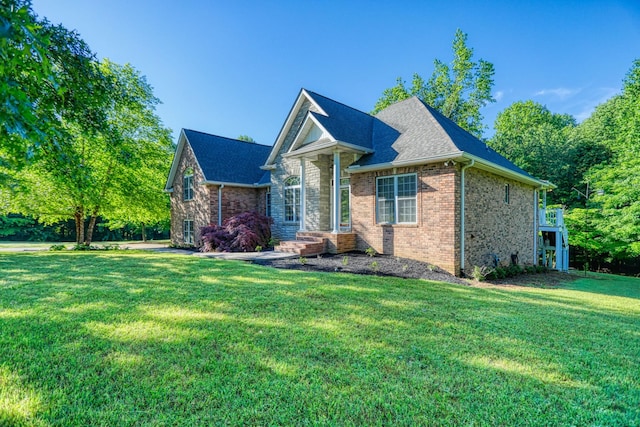 358 Spring Valley Dr, Cottontown, TN 37048 - view of front of house featuring a front lawn, brick siding, stone siding, and a shingled roof