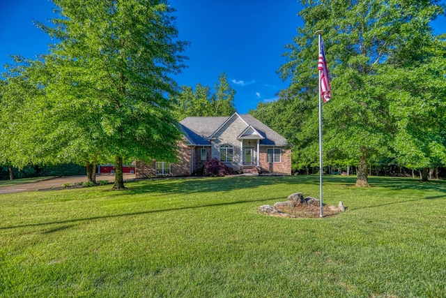 358 Spring Valley Dr, Cottontown, TN 37048 - view of front facade featuring a front lawn and brick siding