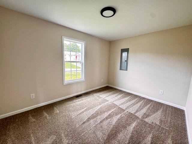 62 Modena Pl, Decherd, TN 37324 - spare room featuring baseboards, carpet, and electric panel