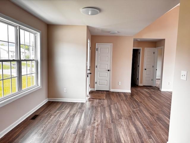 62 Modena Pl, Decherd, TN 37324 - spare room featuring dark wood-style floors and baseboards