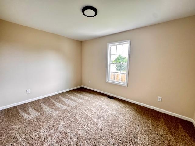 62 Modena Pl, Decherd, TN 37324 - carpeted empty room featuring baseboards