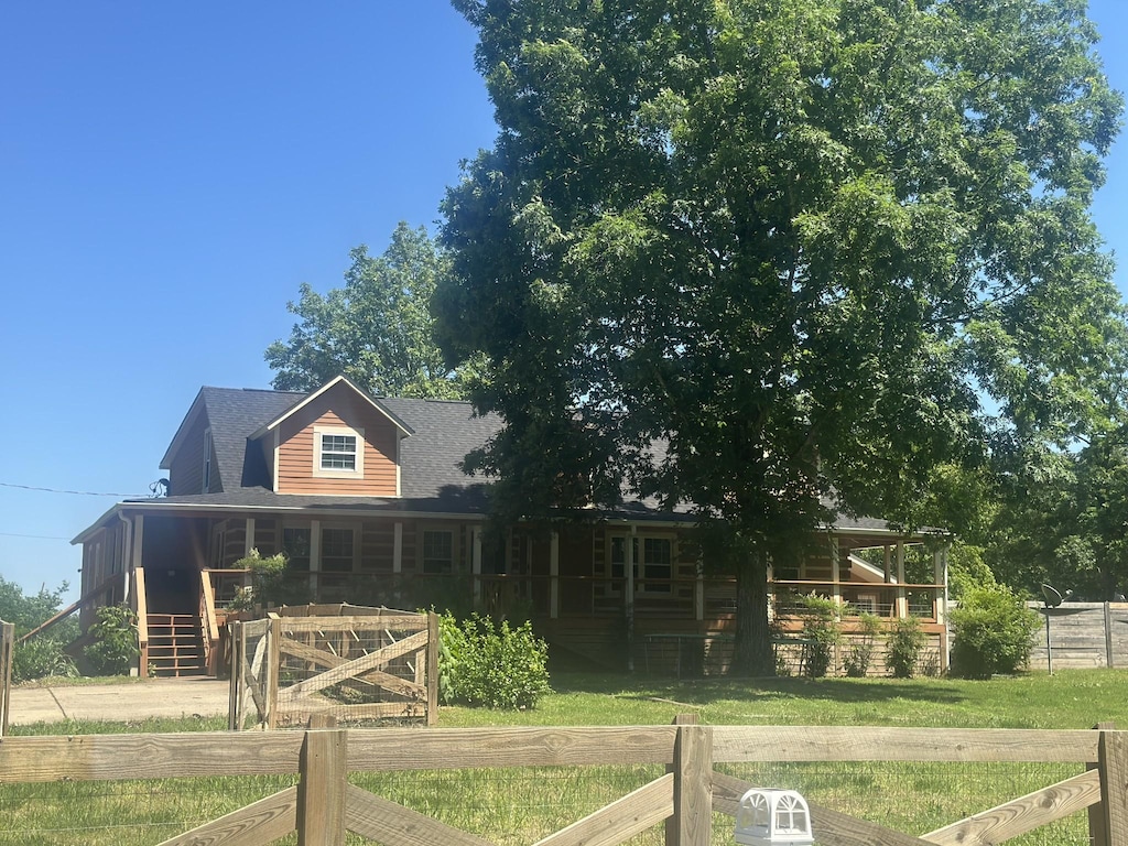 5533 Old Sams Creek Rd, Pegram, TN 37143 - log-style house with fence and covered porch