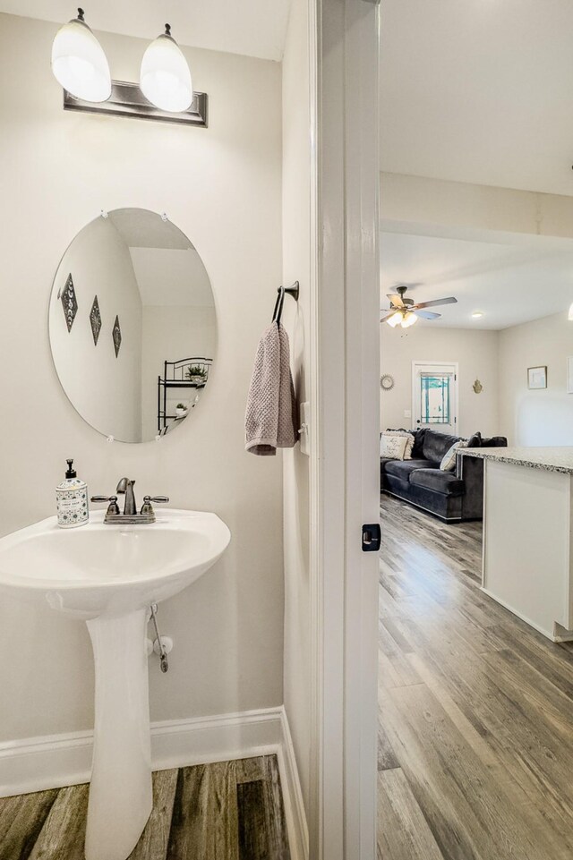 328 Fallow Cir, Clarksville, TN 37040 - bathroom featuring wood finished floors, ceiling fan, and baseboards