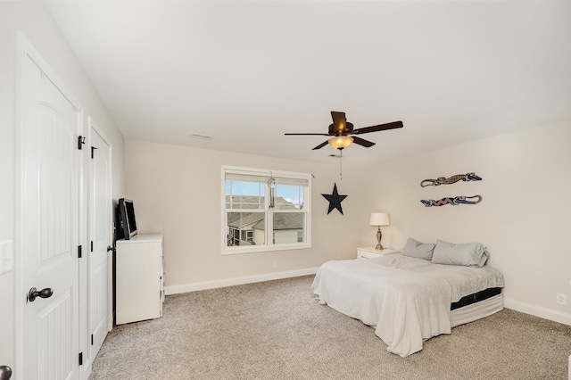 328 Fallow Cir, Clarksville, TN 37040 - bedroom featuring baseboards, light colored carpet, and a ceiling fan