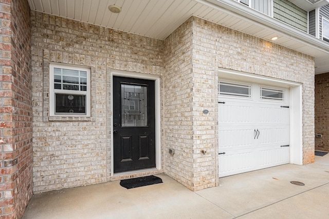 328 Fallow Cir, Clarksville, TN 37040 - view of exterior entry featuring brick siding and a garage