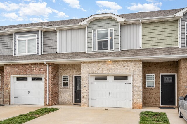 328 Fallow Cir, Clarksville, TN 37040 - multi unit property with an attached garage, concrete driveway, brick siding, and roof with shingles