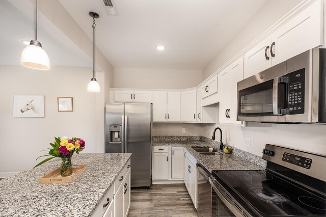 328 Fallow Cir, Clarksville, TN 37040 - kitchen featuring appliances with stainless steel finishes, a sink, white cabinetry, light stone countertops, and recessed lighting