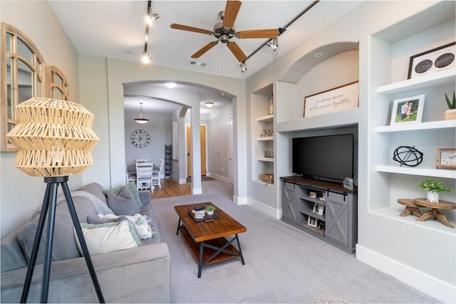 2600 Hillsboro Pike Unit 453, Nashville, TN 37212 - carpeted living area with built in features, ceiling fan, arched walkways, track lighting, and baseboards