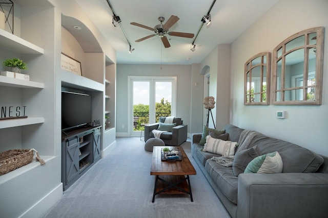 2600 Hillsboro Pike Unit 453, Nashville, TN 37212 - living room featuring track lighting, a ceiling fan, light carpet, and built in features