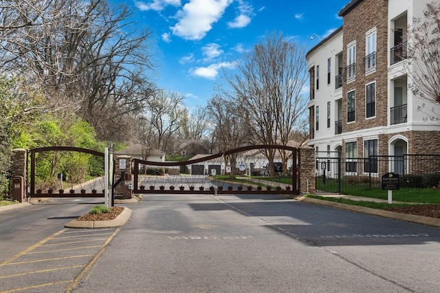 2600 Hillsboro Pike Unit 453, Nashville, TN 37212 - view of asphalt road with a gate, a gated entry, curbs, and sidewalks