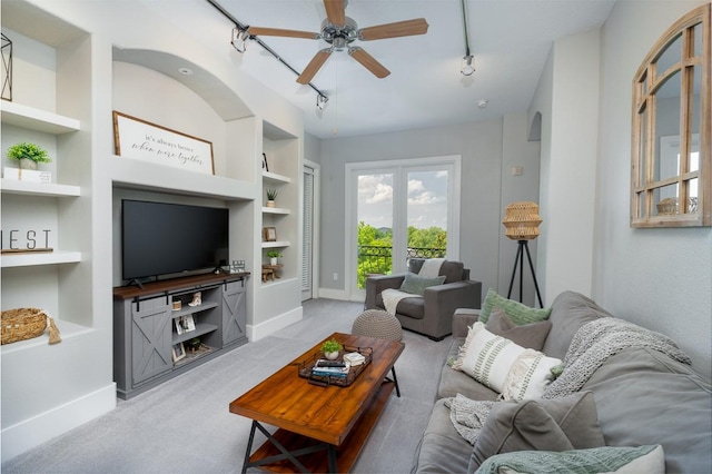 2600 Hillsboro Pike Unit 453, Nashville, TN 37212 - living room featuring track lighting, built in features, baseboards, and light carpet