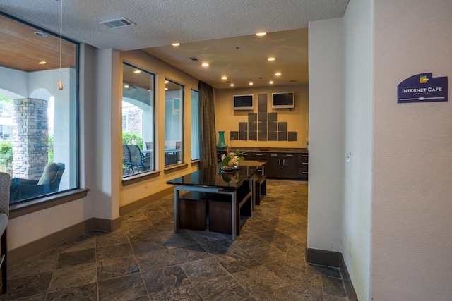 2600 Hillsboro Pike Unit 453, Nashville, TN 37212 - kitchen with baseboards, dark stone finish flooring, decorative light fixtures, recessed lighting, and a textured ceiling
