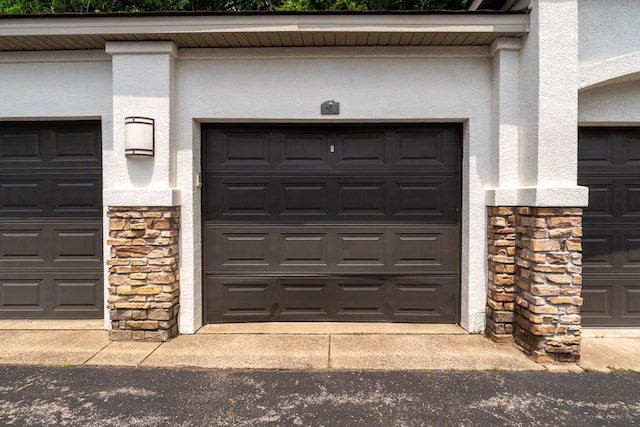 2600 Hillsboro Pike Unit 453, Nashville, TN 37212 - view of exterior entry featuring stone siding, stucco siding, and community garages