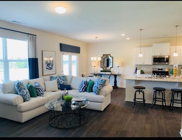 4028 Roane Dr, White House, TN 37188 - living room featuring baseboards, dark wood finished floors, and recessed lighting