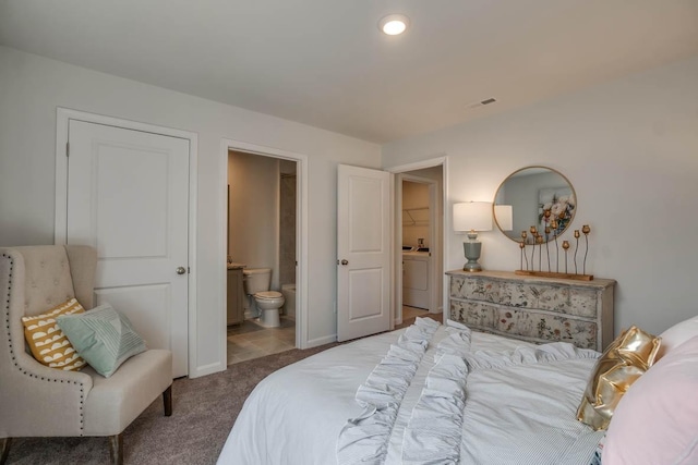 4028 Roane Dr, White House, TN 37188 - bedroom featuring washer / dryer, carpet flooring, ensuite bathroom, and baseboards