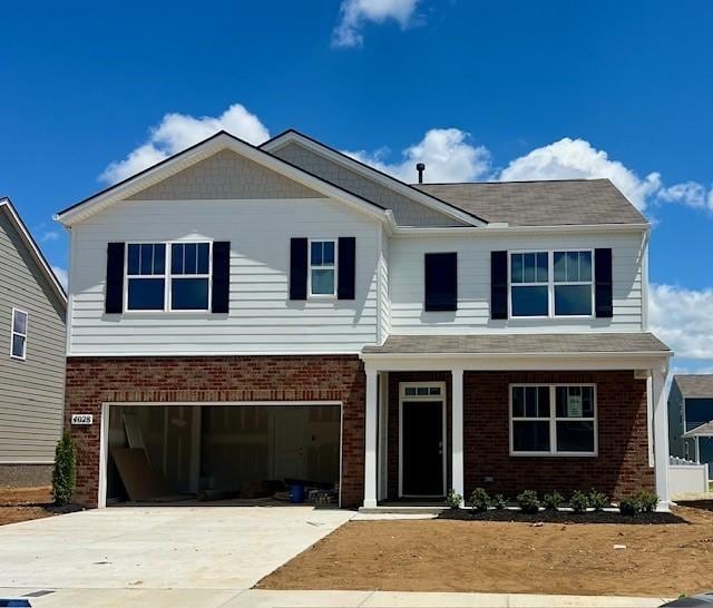 4028 Roane Dr, White House, TN 37188 - craftsman-style house with brick siding, an attached garage, and concrete driveway