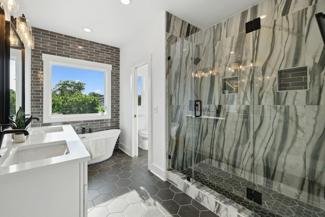 2211 18th Ave N, Nashville, TN 37208 - full bathroom featuring tile patterned floors, recessed lighting, a marble finish shower, a freestanding tub, and double vanity