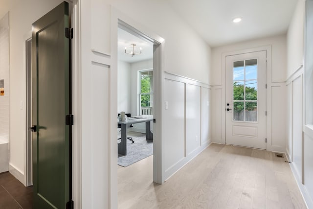 301B Oriel Ave, Nashville, TN 37210 - corridor with a decorative wall, an office area, wainscoting, light wood-style flooring, and a chandelier