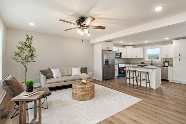 1515 Ellie Claire Way, Lewisburg, TN 37091 - living room featuring light wood-style flooring, recessed lighting, a ceiling fan, and baseboards