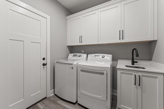512 River Watch Way, Winchester, TN 37398 - clothes washing area with cabinet space, separate washer and dryer, and wood finish floors