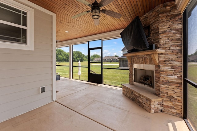 512 River Watch Way, Winchester, TN 37398 - unfurnished sunroom featuring an outdoor stone fireplace and a ceiling fan
