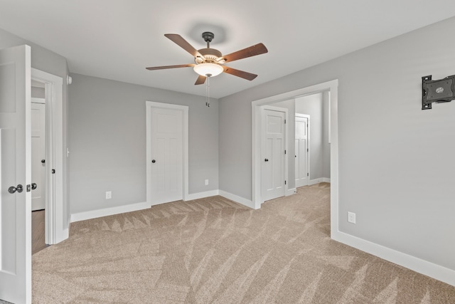 512 River Watch Way, Winchester, TN 37398 - unfurnished bedroom with light colored carpet, baseboards, and ceiling fan